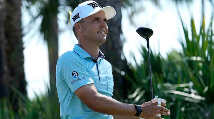 Eric Cole watches a shot at the 2023 Honda Classic.